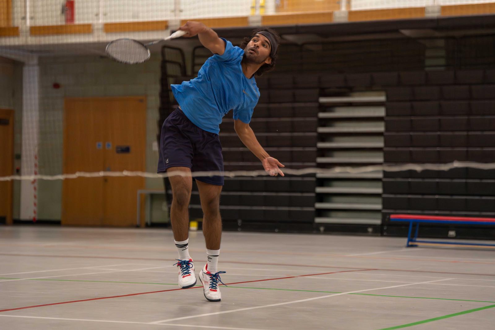 Photo of me playing in a badminton match